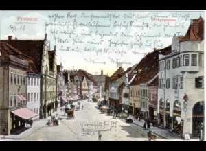 Freising, Hauptstrasse m. Geschäften, Fuhrwerken u. Personen, 1913 gebr. Farb AK