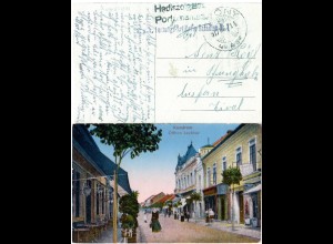 Ungarn, Komarom m. Geschäften u. Personen, 1917 m. Feldpost gebr. Farb-AK